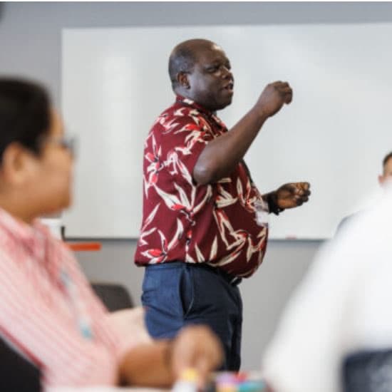 Dr Ajibade facilitating a workshop with students